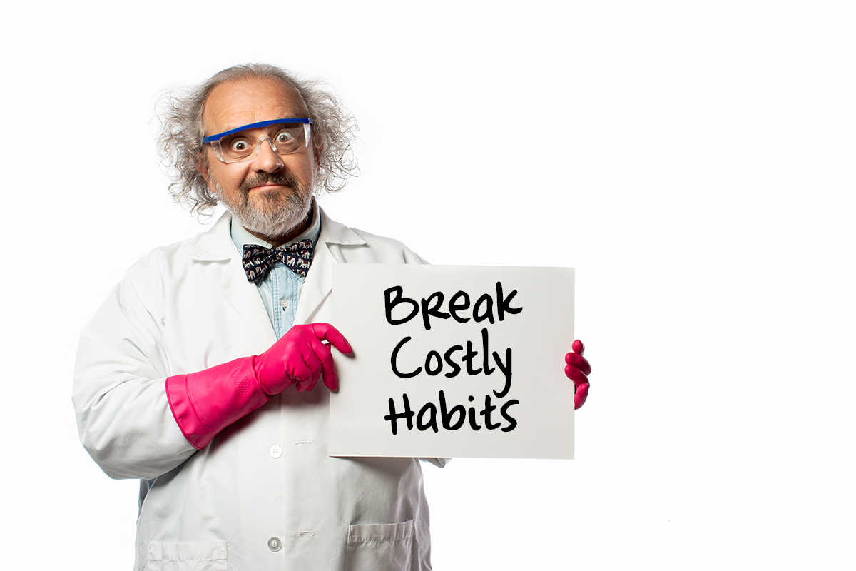 Scientist holds a sign with the words break costly habits.