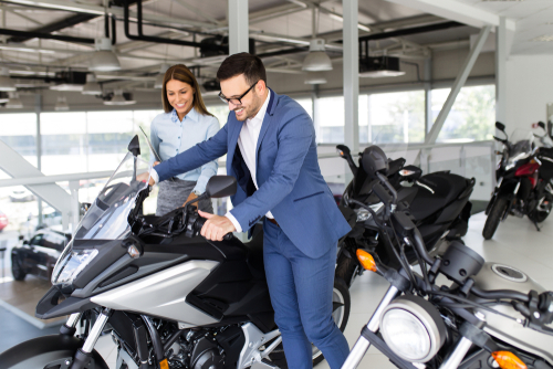 Recreational vehicle toys-man looking in a motorcycle showroom