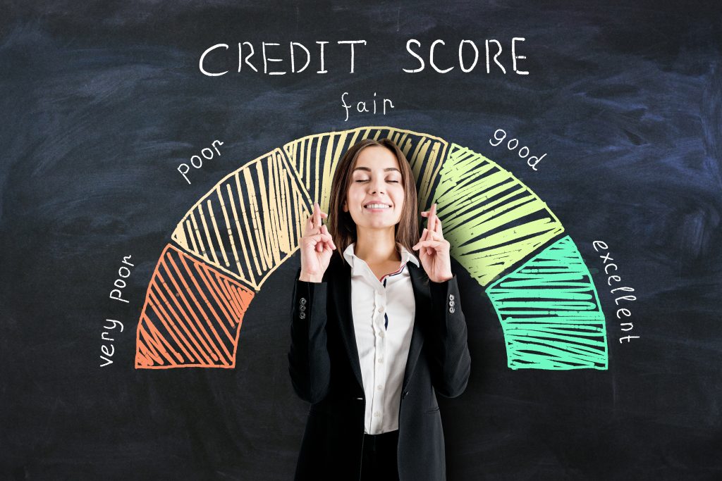 Credit score range with hopeful woman examining her score