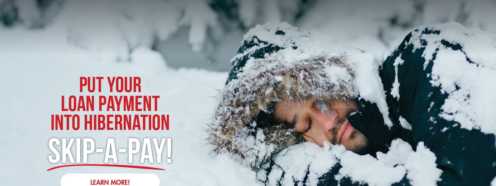 Put your loan payment in hibernation. Image of a man hibernating in a snow drift.