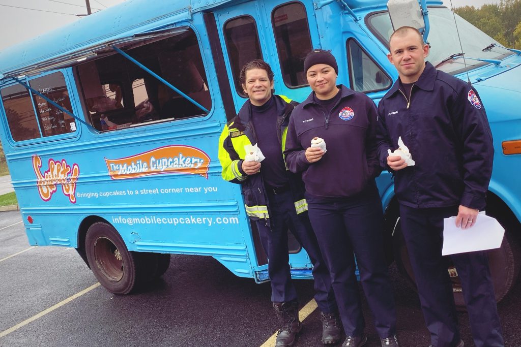 Firefighters who are members enjoy a treat at Member Appreciation Day, one of the advantages of a credit union like FFCCU.