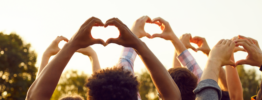 Hands raised into loving hearts as members rejoice about Member Appreciation Day.