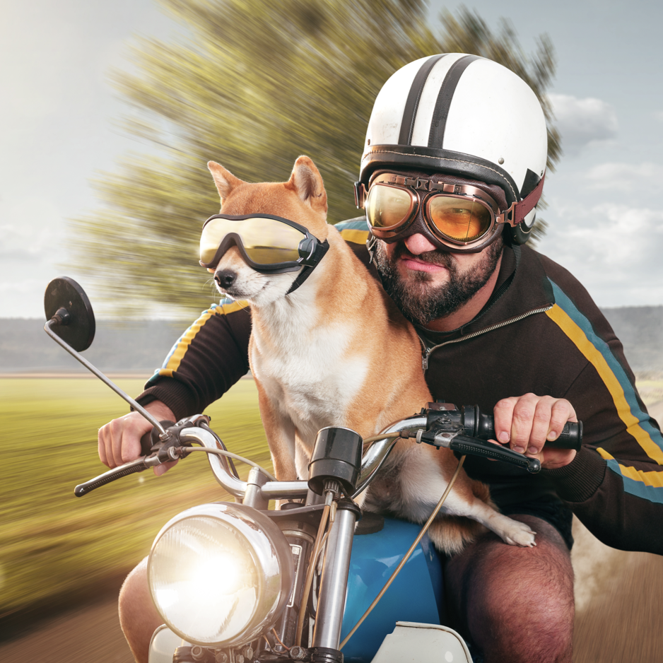 Man who financed with motorcycle with a credit union loan through FFCCU riding with his dog.