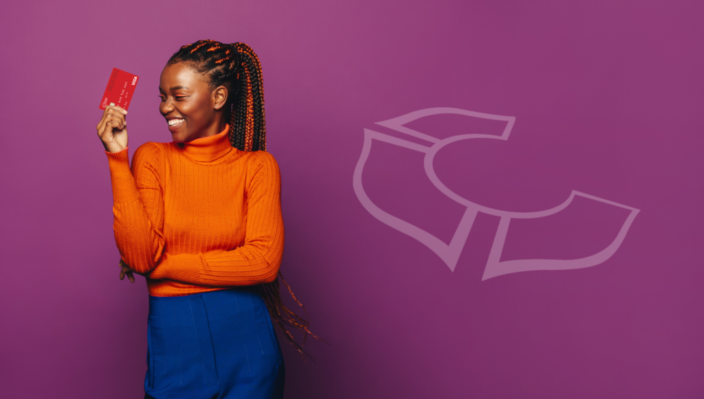 Gen Z financial literacy? Image of a young black woman in an orange sweater holding an FFCCU Great Rate VISA Credit Card.